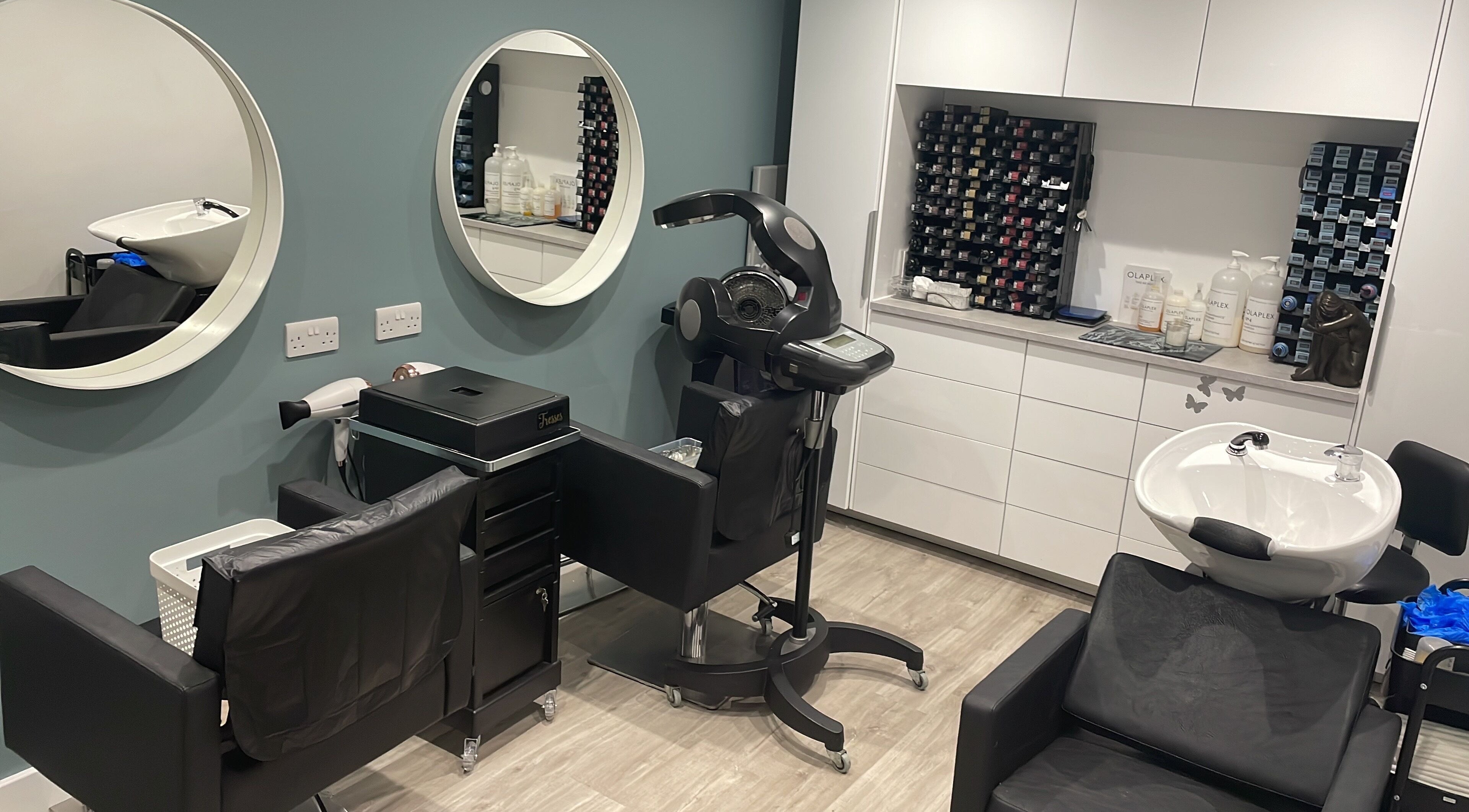 Modern styling station at Tresses Colour & Styling Room in Rochford, England, GB with elegant design and hair products.