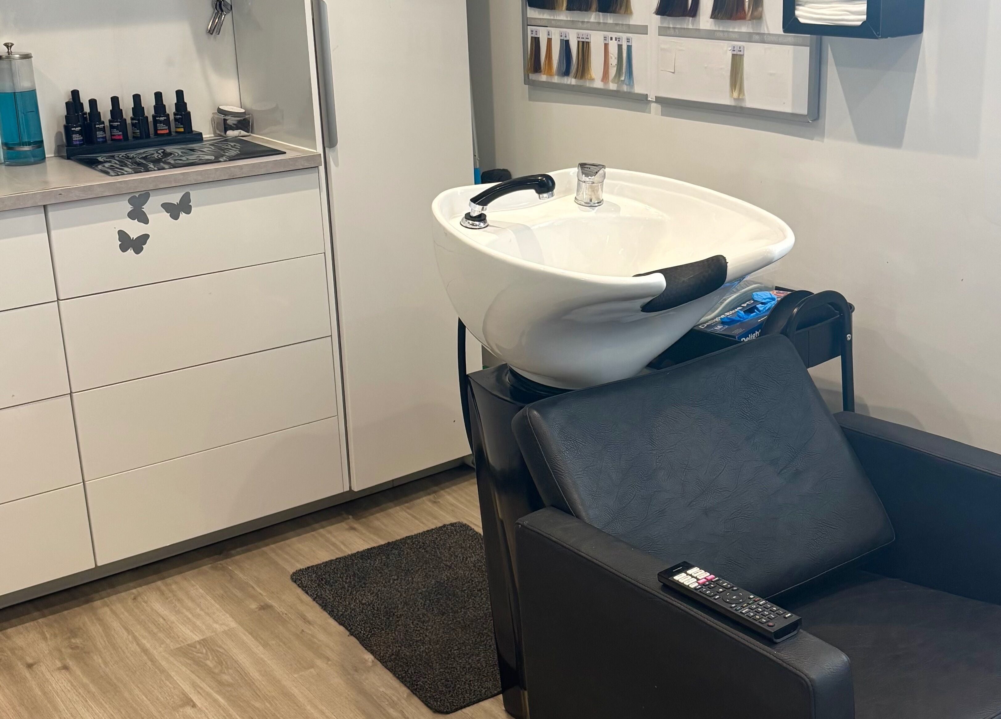 Modern wash station at Tresses Colour & Styling Room, Rochford, England, GB, ready for beauty treatments.