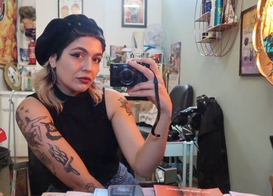 Customer takes a mirror selfie at Queer Shears at Jimi’s Barbershop, Brighton, England, GB.