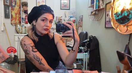 Customer takes a mirror selfie at Queer Shears at Jimi’s Barbershop, Brighton, England, GB.