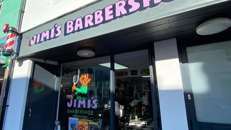 Exterior of Queer Shears @ Jimi’s Barbershop in Brighton, England, GB with colorful signage.