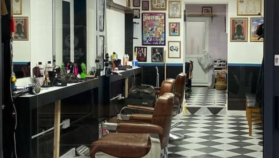 Interior of Queer Shears @ Jimi’s Barbershop, featuring modern chairs and decor in Brighton, England, GB.