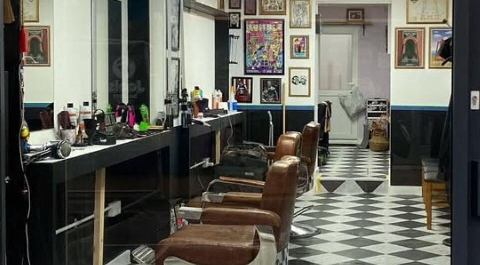 Interior of Queer Shears @ Jimi’s Barbershop, featuring modern chairs and decor in Brighton, England, GB.