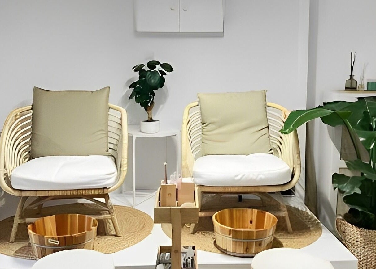 Tranquil pedicure chairs at Bless Nails Lisbon in Lisboa, Lisboa, PT surrounded by lush plants.