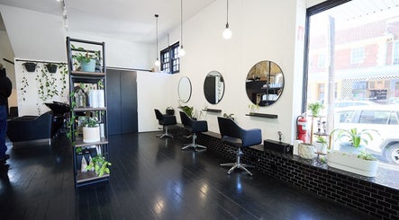 Interior of Blockhead Salon in Bondi Junction, New South Wales, AU with modern styling chairs and mirrors.