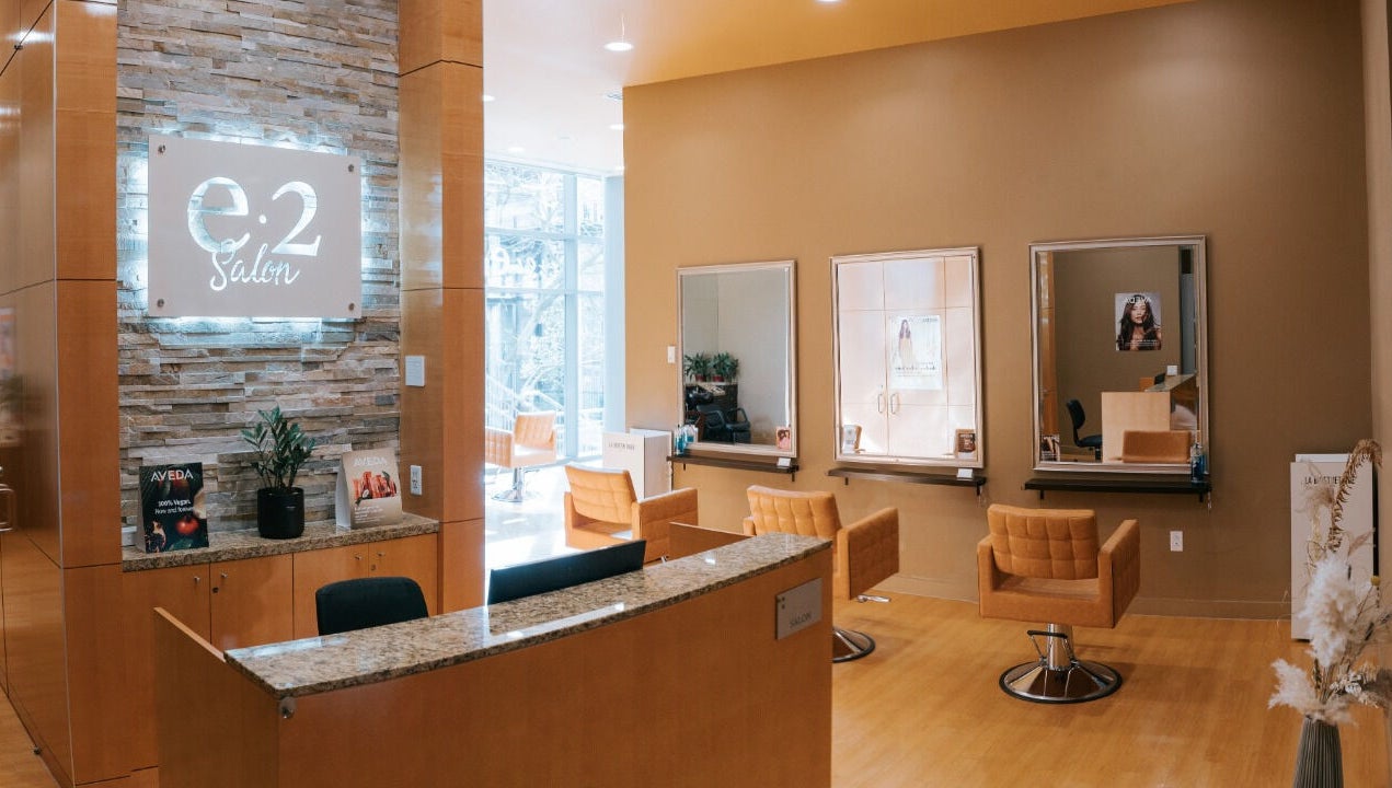 Interior of E2 Salon Ubc featuring modern chairs and mirrors in Vancouver, British Columbia, CA.