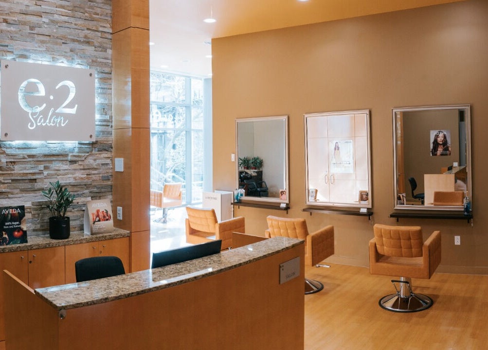 Interior of E2 Salon Ubc featuring modern chairs and mirrors in Vancouver, British Columbia, CA.