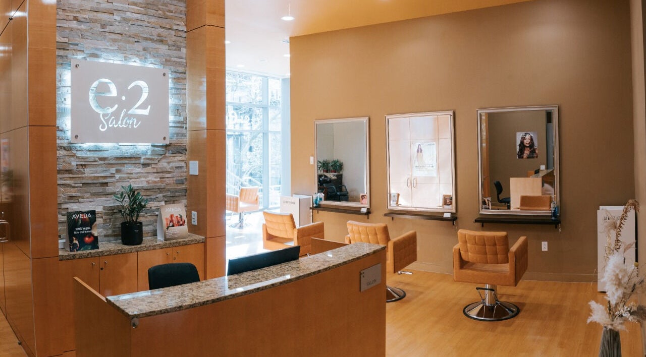 Interior of E2 Salon Ubc featuring modern chairs and mirrors in Vancouver, British Columbia, CA.