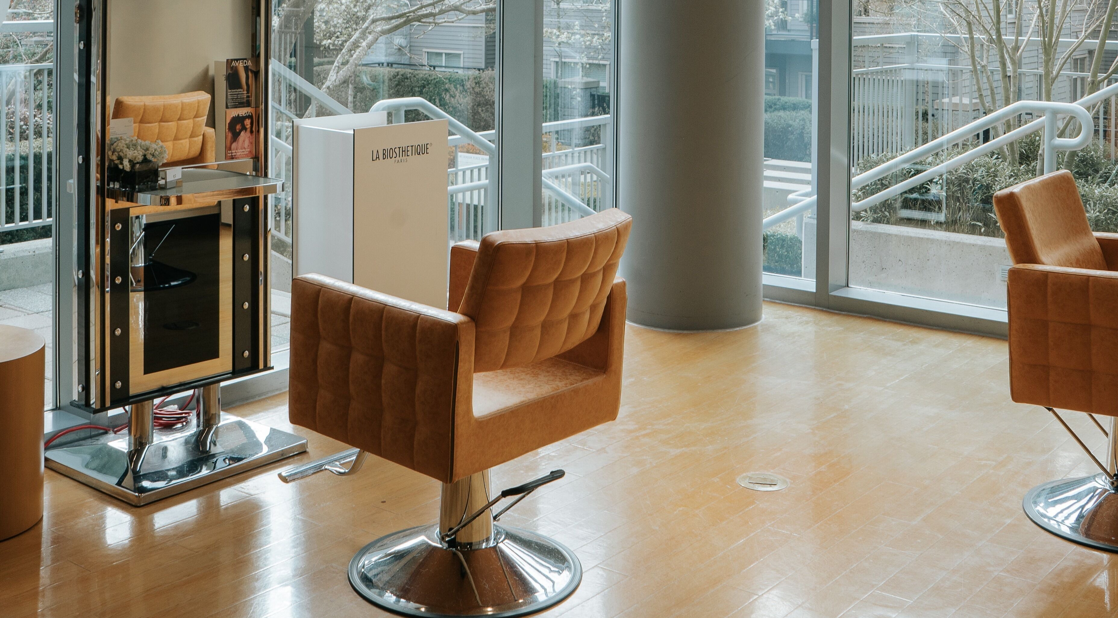 Stylish seating at E2 Salon Ubc in Vancouver, British Columbia, CA offers a relaxing ambiance.