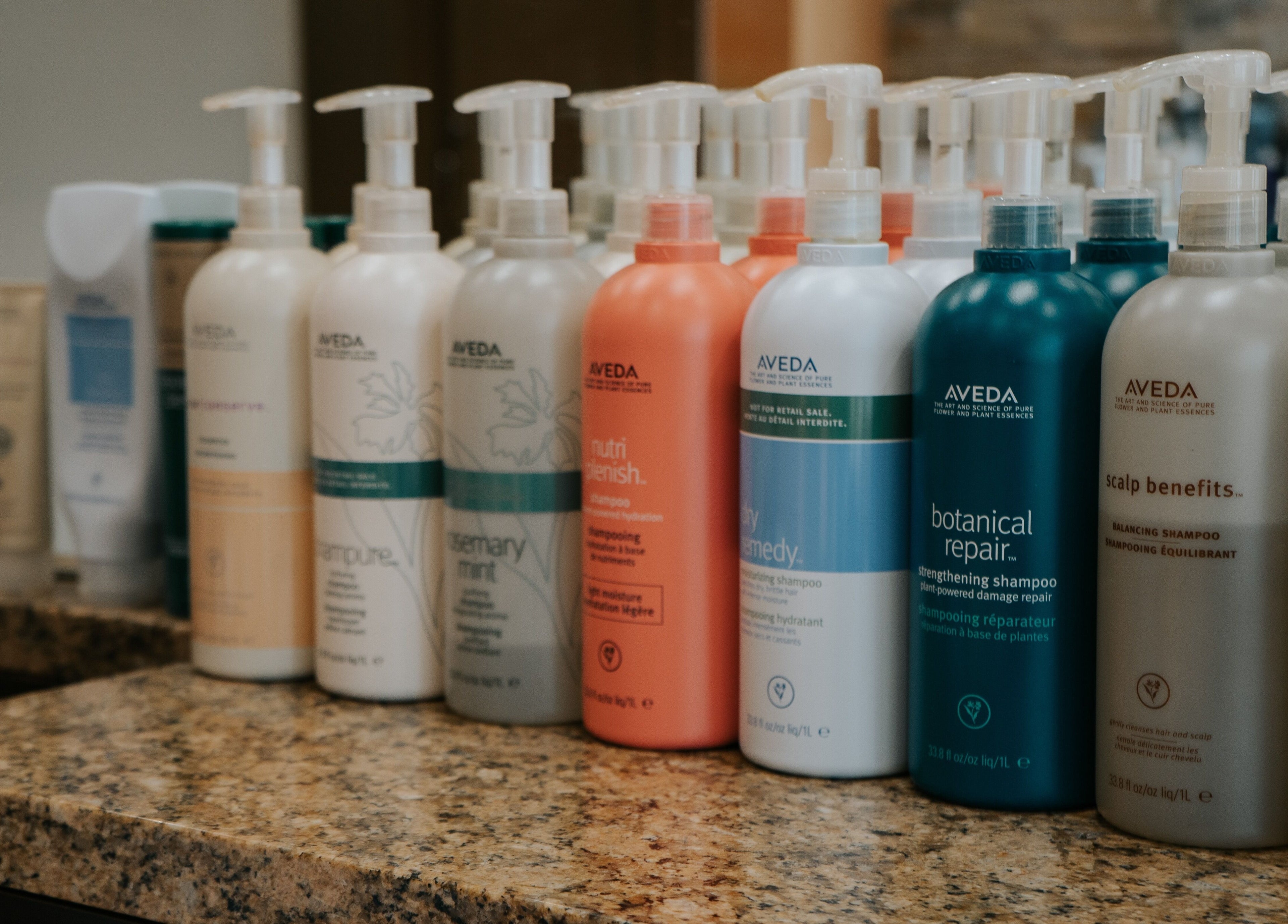 Aveda shampoo products on display at E2 Salon Ubc, Vancouver, British Columbia, CA, showcasing premium haircare.