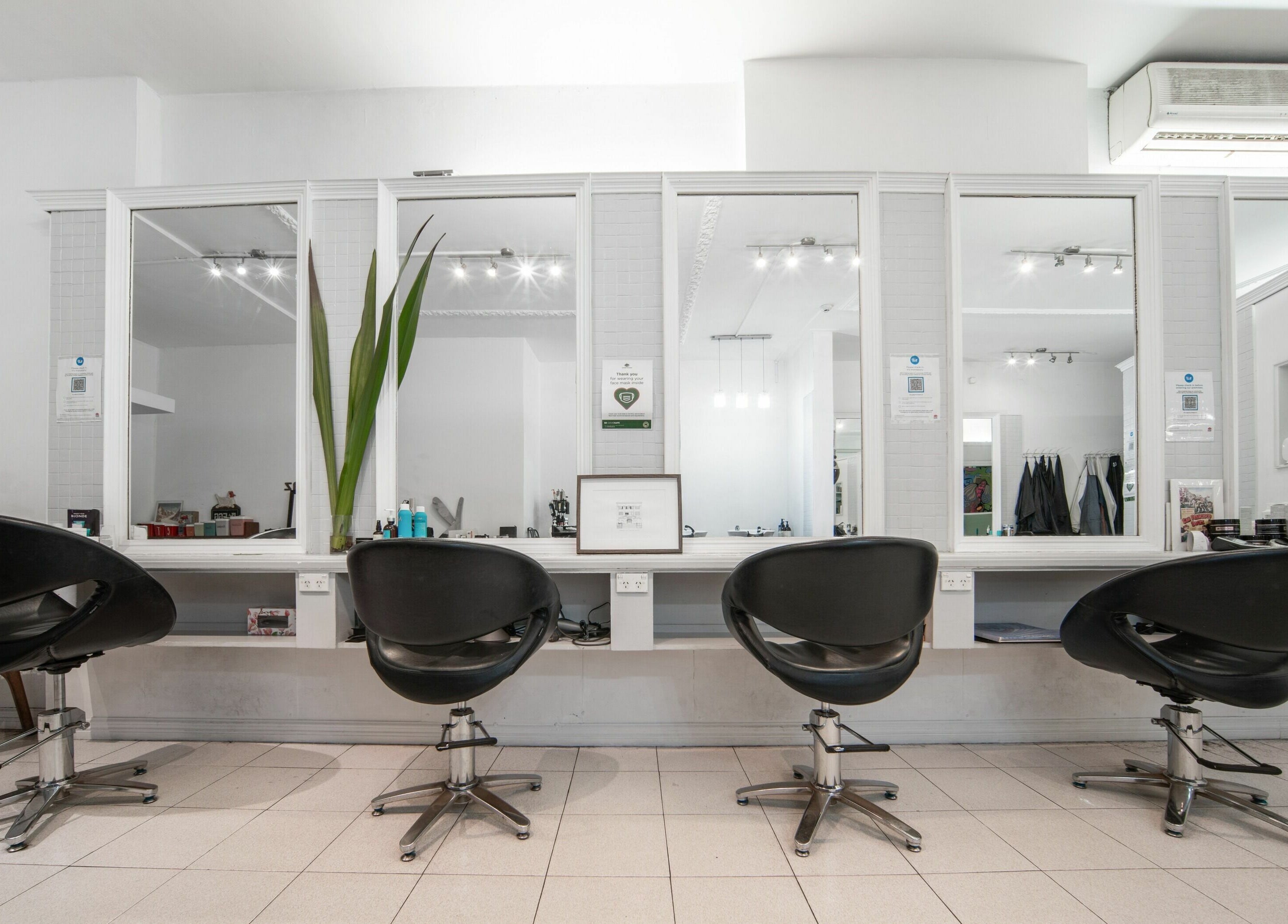 Modern styling chairs at Amore Salon, Potts Point, New South Wales, AU, reflecting elegant salon ambiance.