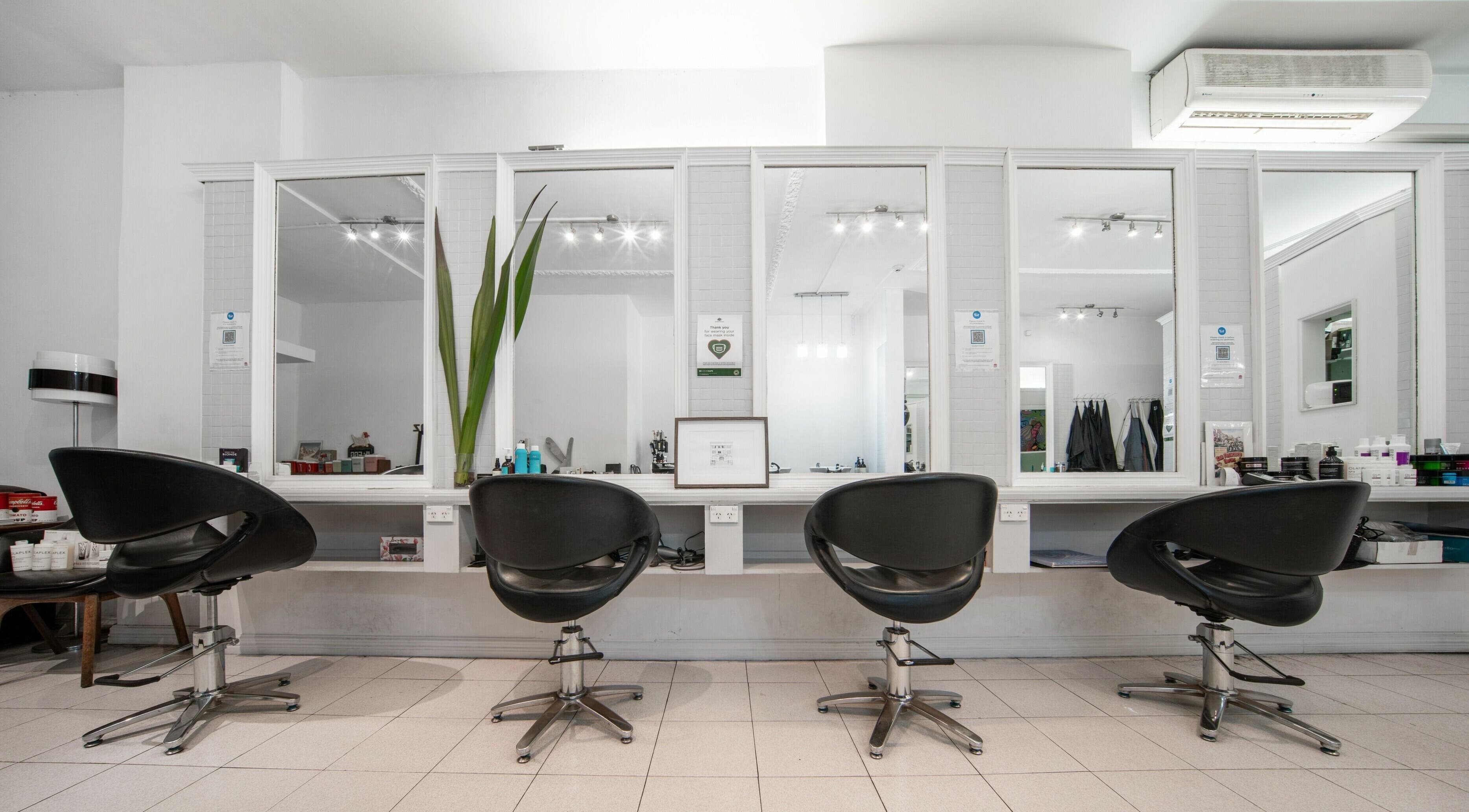 Modern styling chairs at Amore Salon, Potts Point, New South Wales, AU, reflecting elegant salon ambiance.