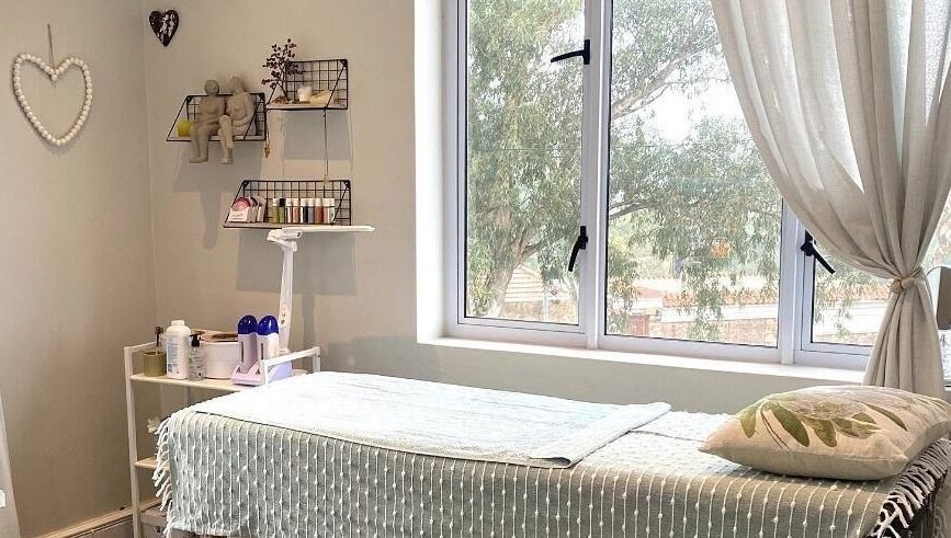 Cozy treatment room at Lily & Lime Beauty Bar, Gqeberha, Eastern Cape, ZA with a massage table and soft lighting.
