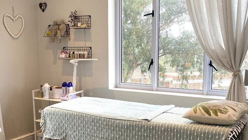 Cozy treatment room at Lily & Lime Beauty Bar, Gqeberha, Eastern Cape, ZA with a massage table and soft lighting.