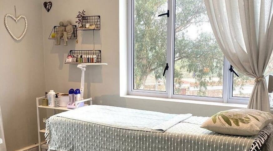 Cozy treatment room at Lily & Lime Beauty Bar, Gqeberha, Eastern Cape, ZA with a massage table and soft lighting.