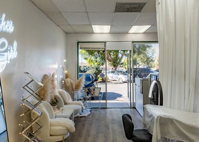 Modern interior of Lashes Girl in West Covina, California, US featuring elegant seating and a stylish treatment area.