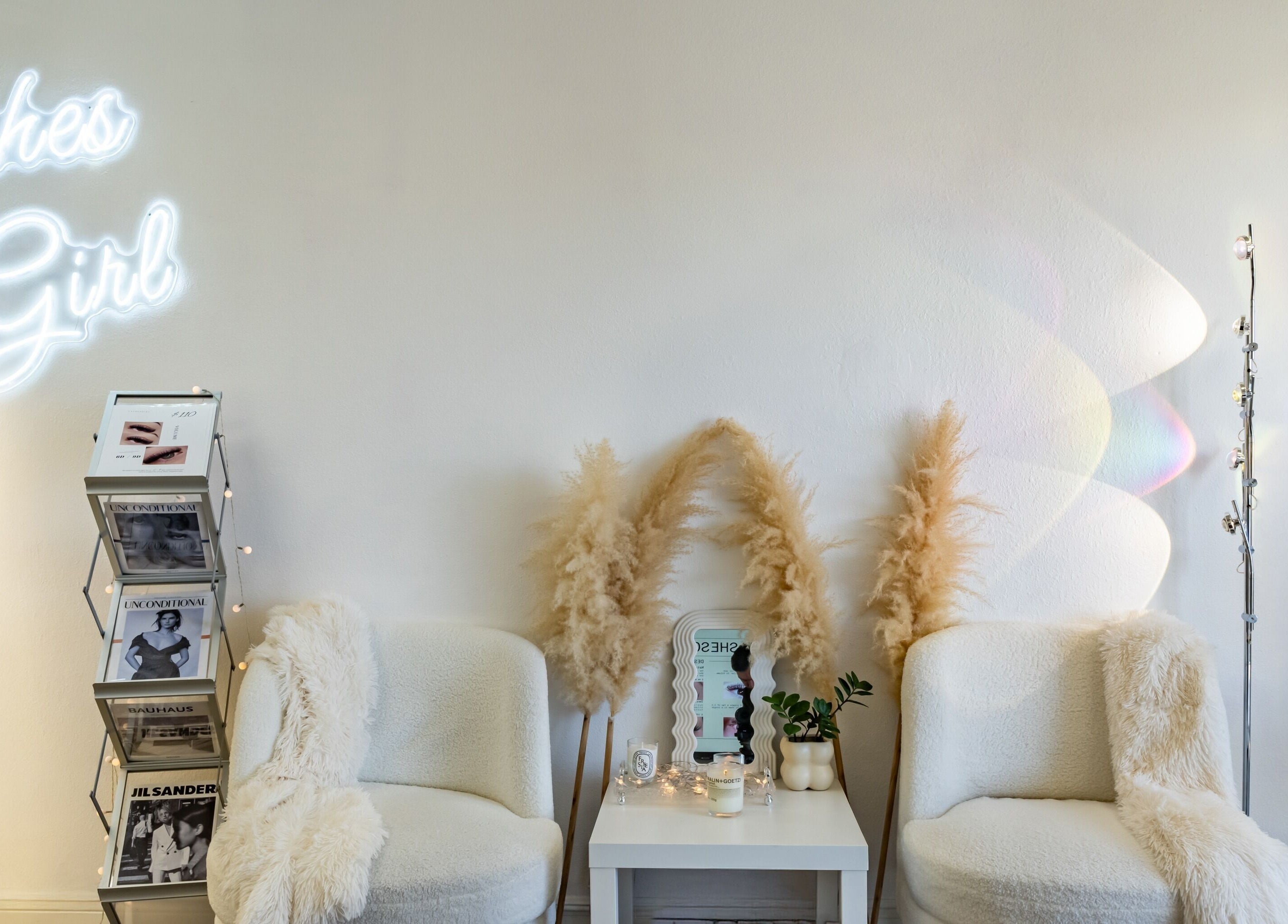 Stylish waiting area at Lashes Girl, West Covina, California, US with plush seating and decor.