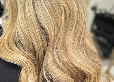 Elegant blonde waves styled at Diane at Aura, Chester, England, GB hair salon.