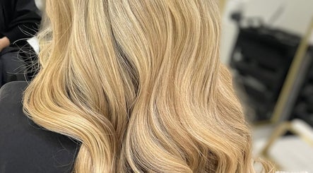 Elegant blonde waves styled at Diane at Aura, Chester, England, GB hair salon.