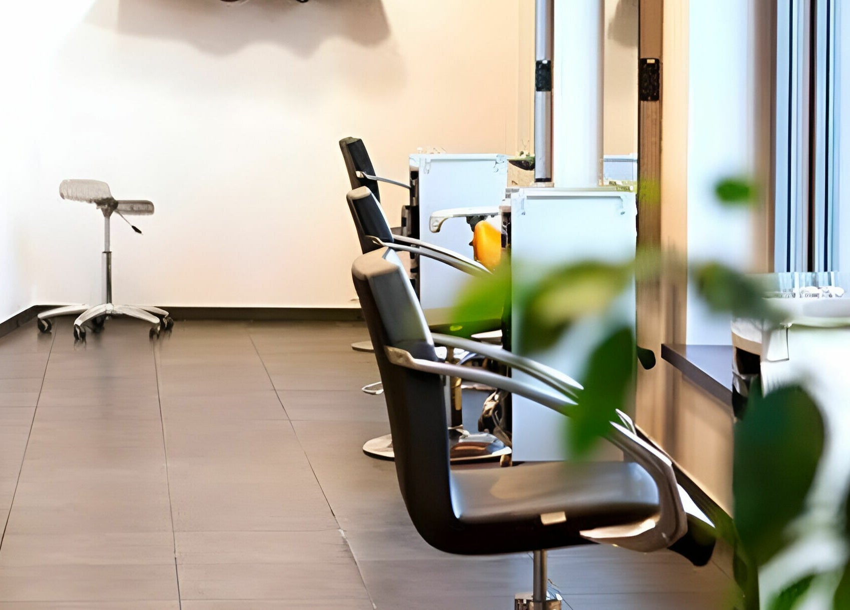 Chic salon seating at LE STUDIO, Rīga, LV. Elegant and modern beauty venue setup.