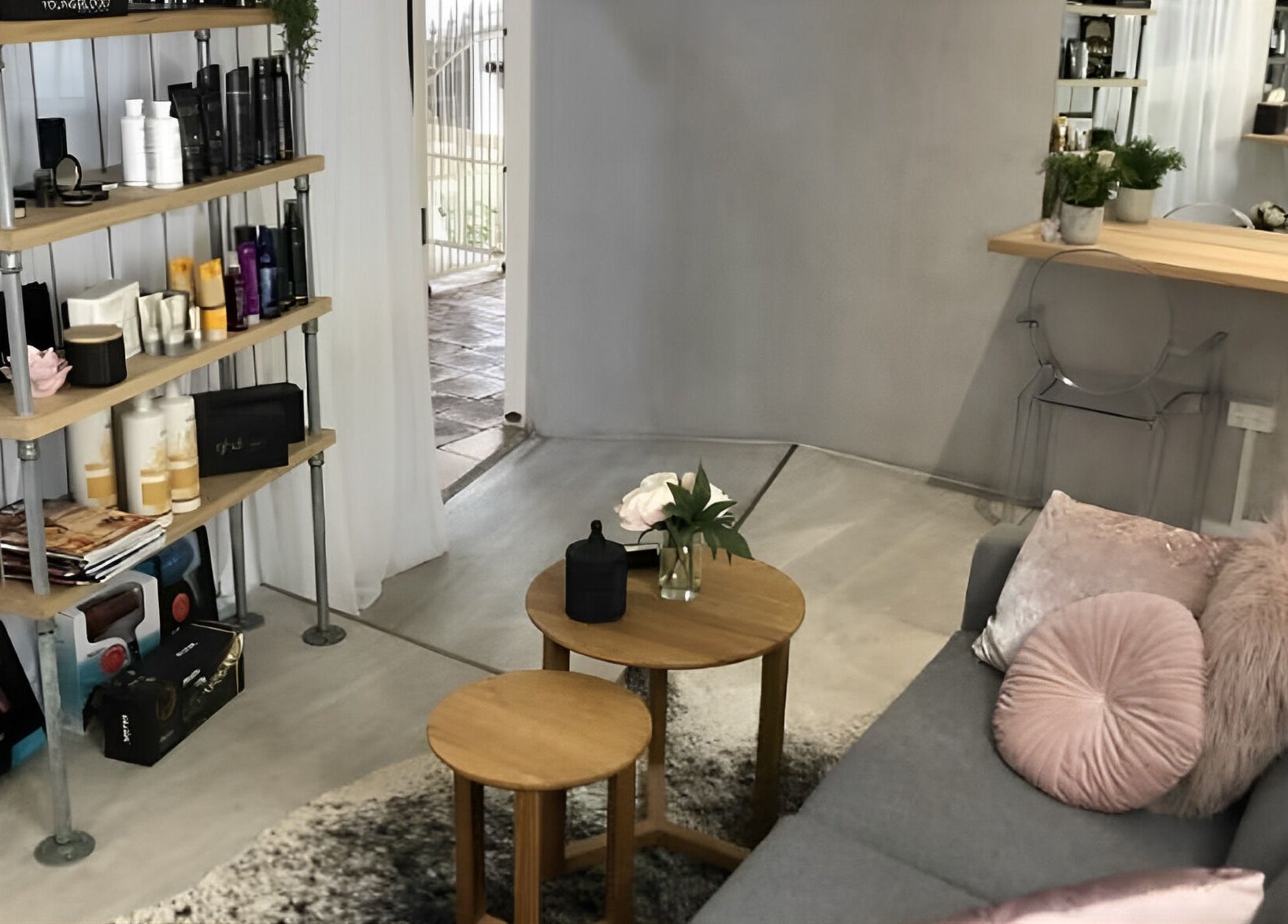 Chic interior of Emily Glasson Hair Makeup and Styling in Maroochydore, Queensland, AU, showcasing elegant decor and products.