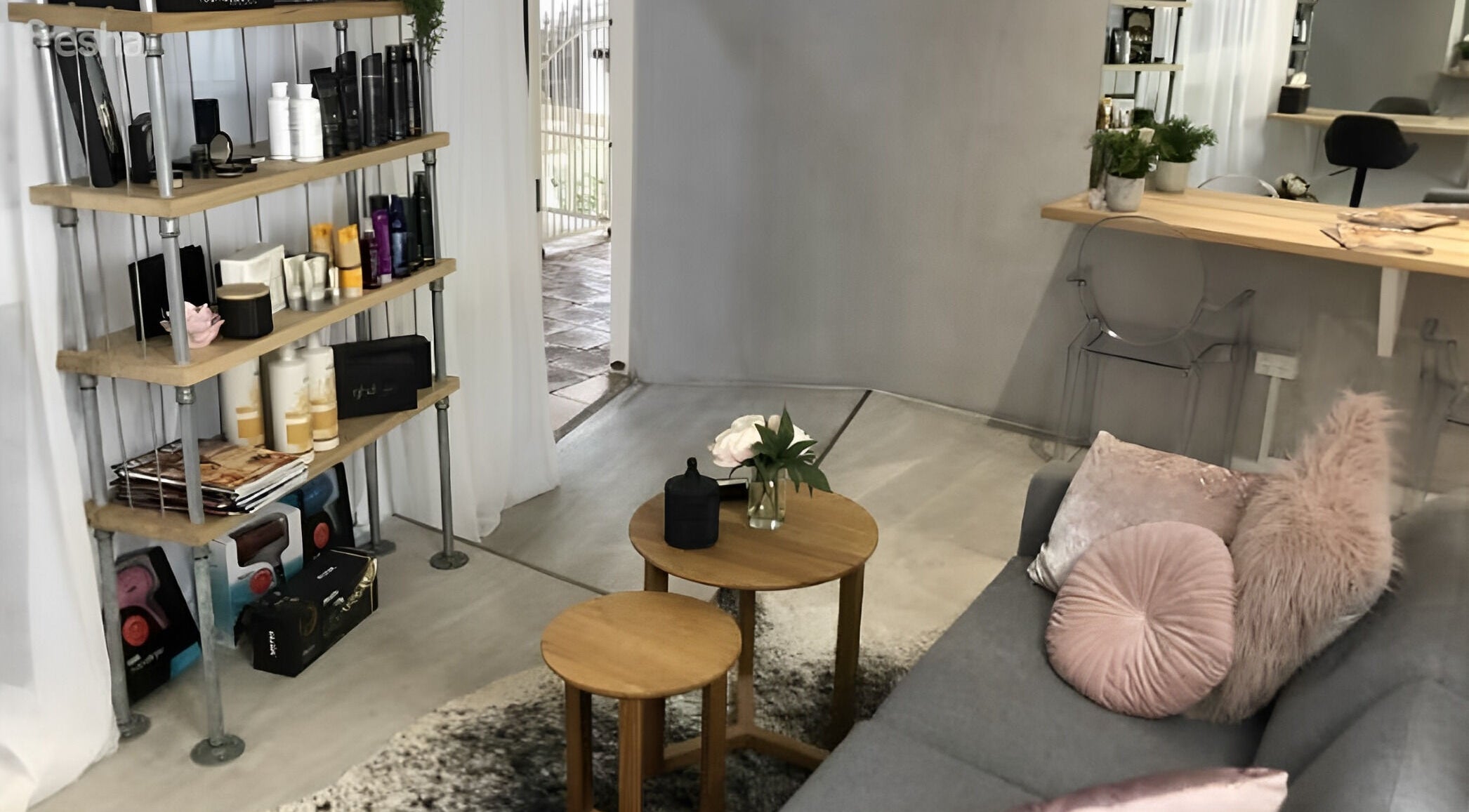 Chic interior of Emily Glasson Hair Makeup and Styling in Maroochydore, Queensland, AU, showcasing elegant decor and products.