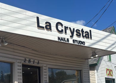 Exterior of La Crystal Studio, a beauty venue in Ottawa, Ontario, CA with a welcoming sign.