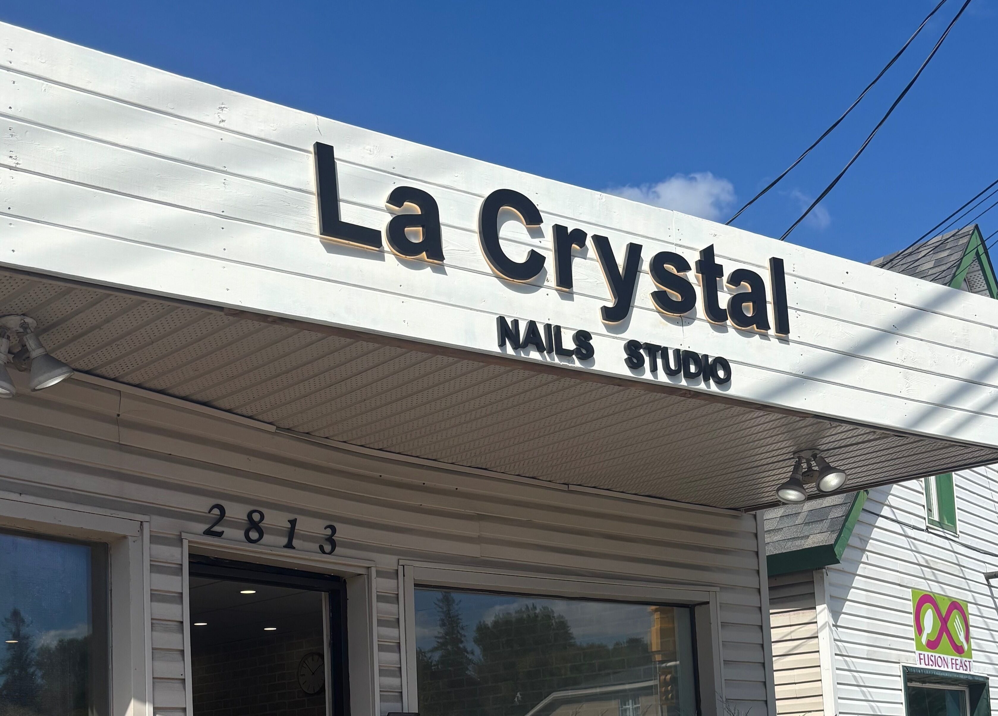 La Crystal Nail Studio exterior facade in Ottawa, Ontario, CA, showcasing its stylish signage.