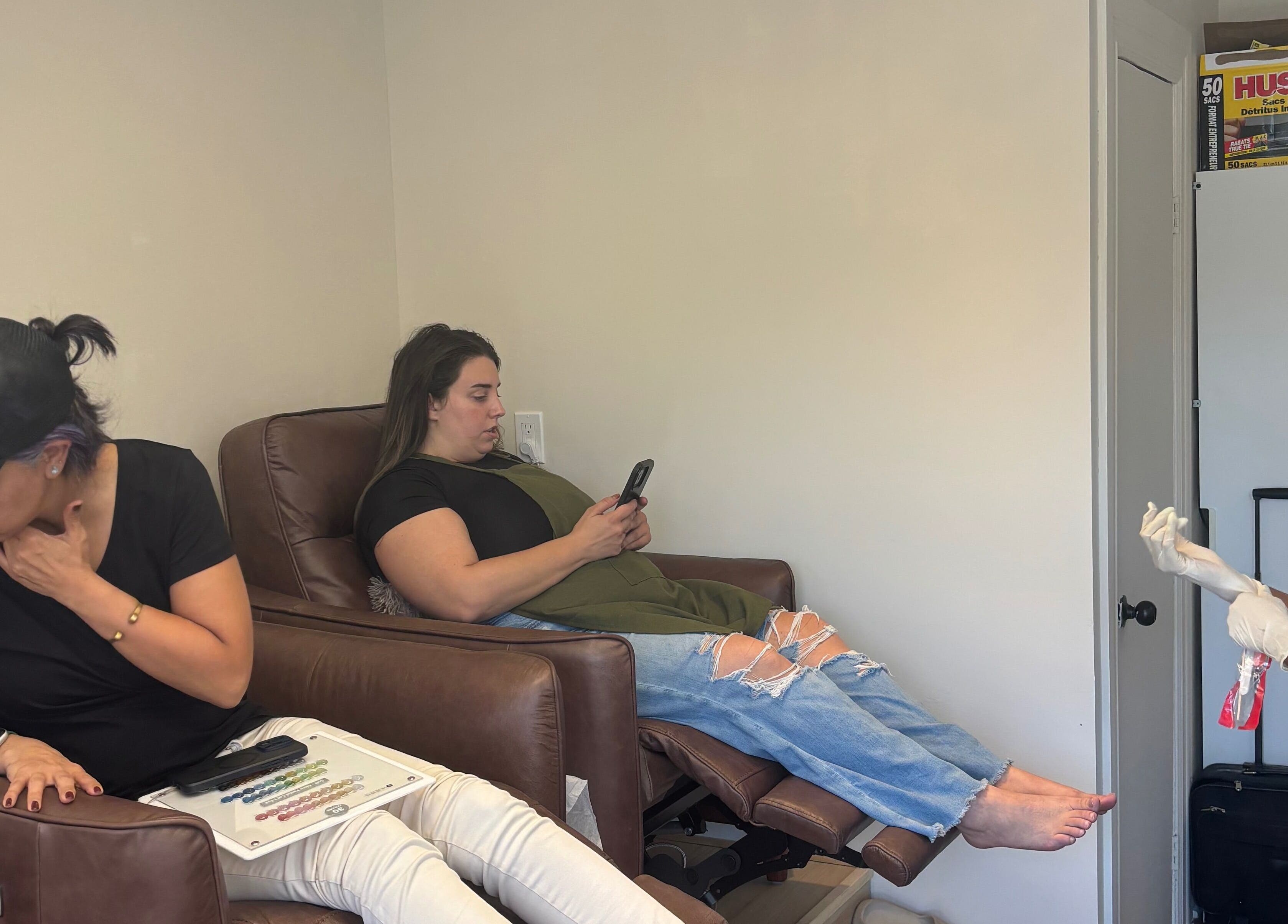 Clients enjoying services at La Crystal Nail Studio, Ottawa, Ontario, CA, enhancing their beauty in a cozy setting.