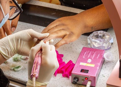 Nail technician at La Crystal Studio - 421 A Cumberland Street, Ottawa, Ontario, CA creating gel nails.