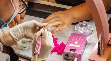 Nail technician at La Crystal Studio - 421 A Cumberland Street, Ottawa, Ontario, CA creating gel nails.