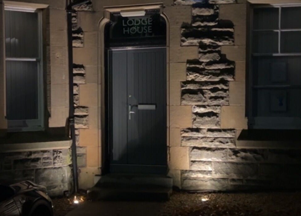 Entrance of ABM Aesthetics and Beauty, Dunfermline, Scotland, GB, showcasing charming stone facade.