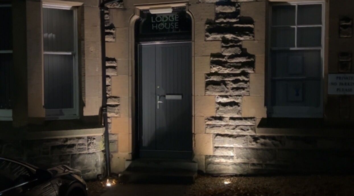 Entrance of ABM Aesthetics and Beauty, Dunfermline, Scotland, GB, showcasing charming stone facade.