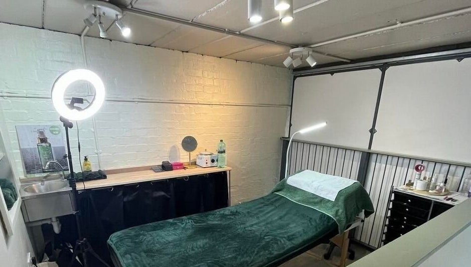 Serene treatment room at Diamond Beauty Zone Ltd, Dundee, Scotland, GB with a cozy massage bed and vanity setup.