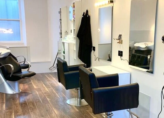 Interior of Diamond Beauty Zone Ltd in Dundee, Scotland, GB, featuring modern salon chairs and sleek design.