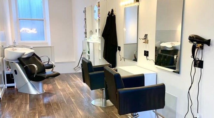 Interior of Diamond Beauty Zone Ltd in Dundee, Scotland, GB, featuring modern salon chairs and sleek design.