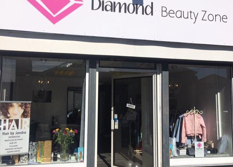 Front view of Diamond Beauty Zone Ltd in Dundee, Scotland, GB with open sign and window display.