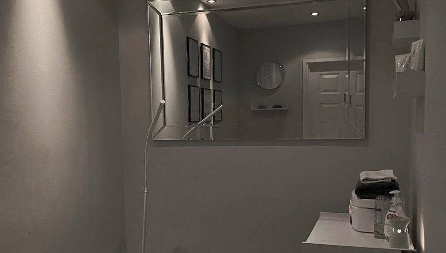 Calming treatment room at Hush Hush Beauty, Old Windsor, England, GB, with soft lighting and modern decor.