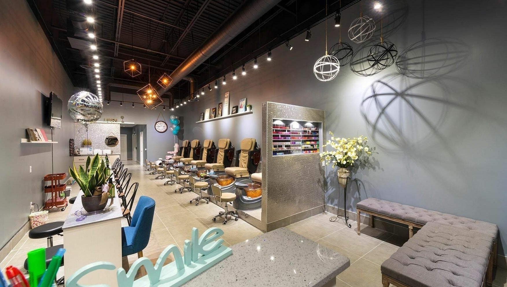 Elegant interior of Glowin’ Nails & Spa in Aurora, Ontario, CA featuring plush seating and modern decor.