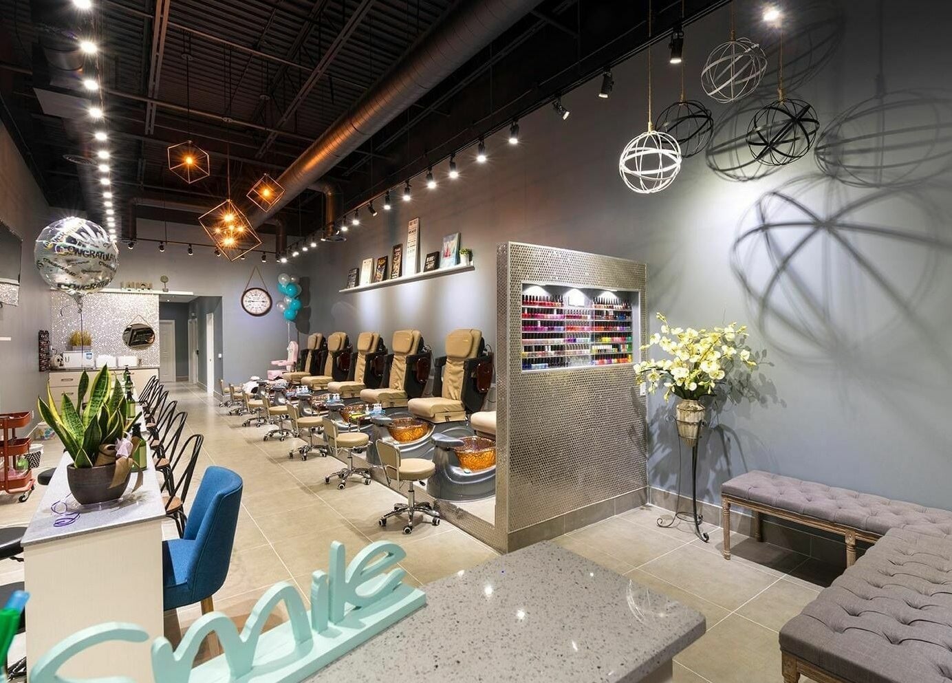 Elegant interior of Glowin’ Nails & Spa in Aurora, Ontario, CA featuring plush seating and modern decor.