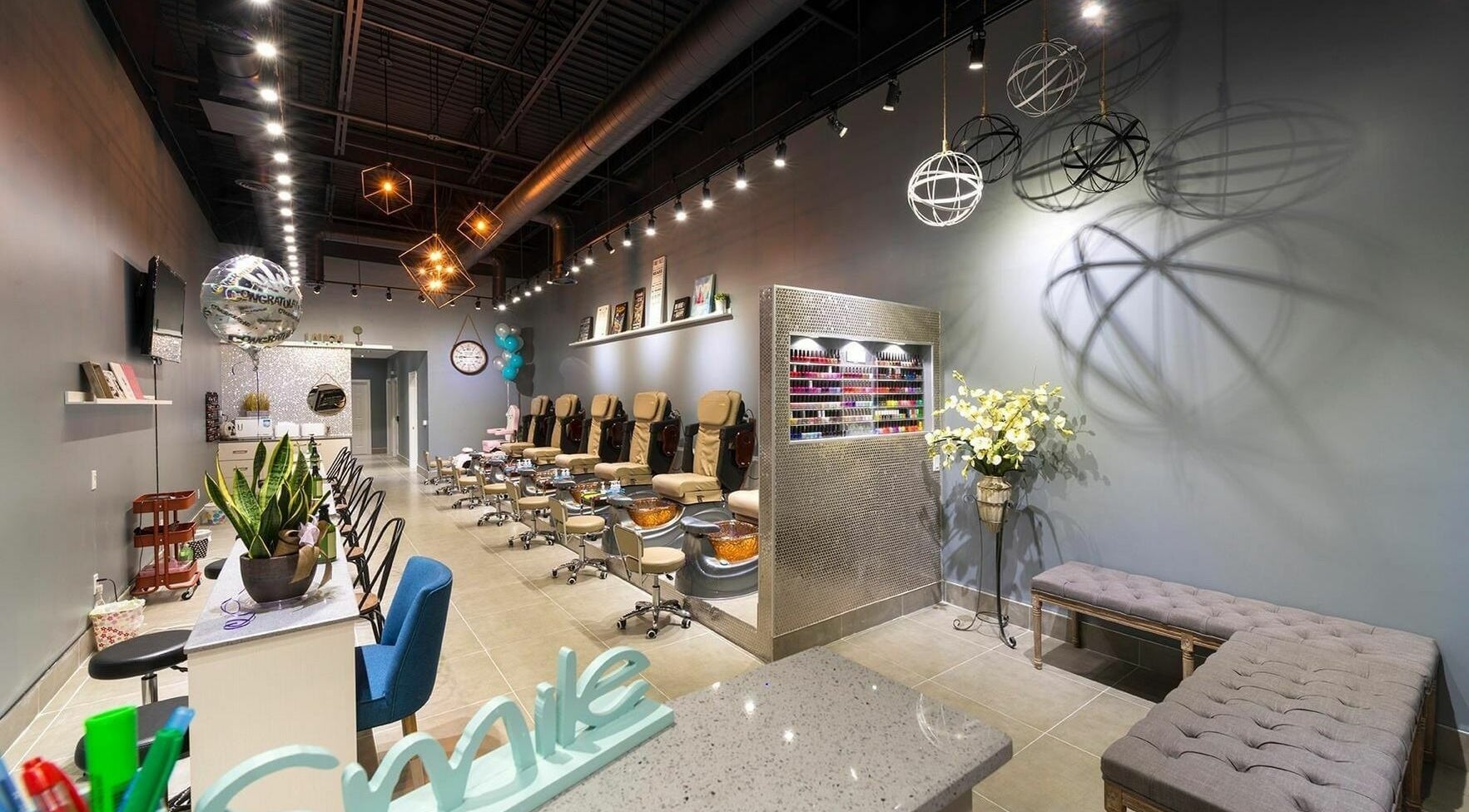 Elegant interior of Glowin’ Nails & Spa in Aurora, Ontario, CA featuring plush seating and modern decor.