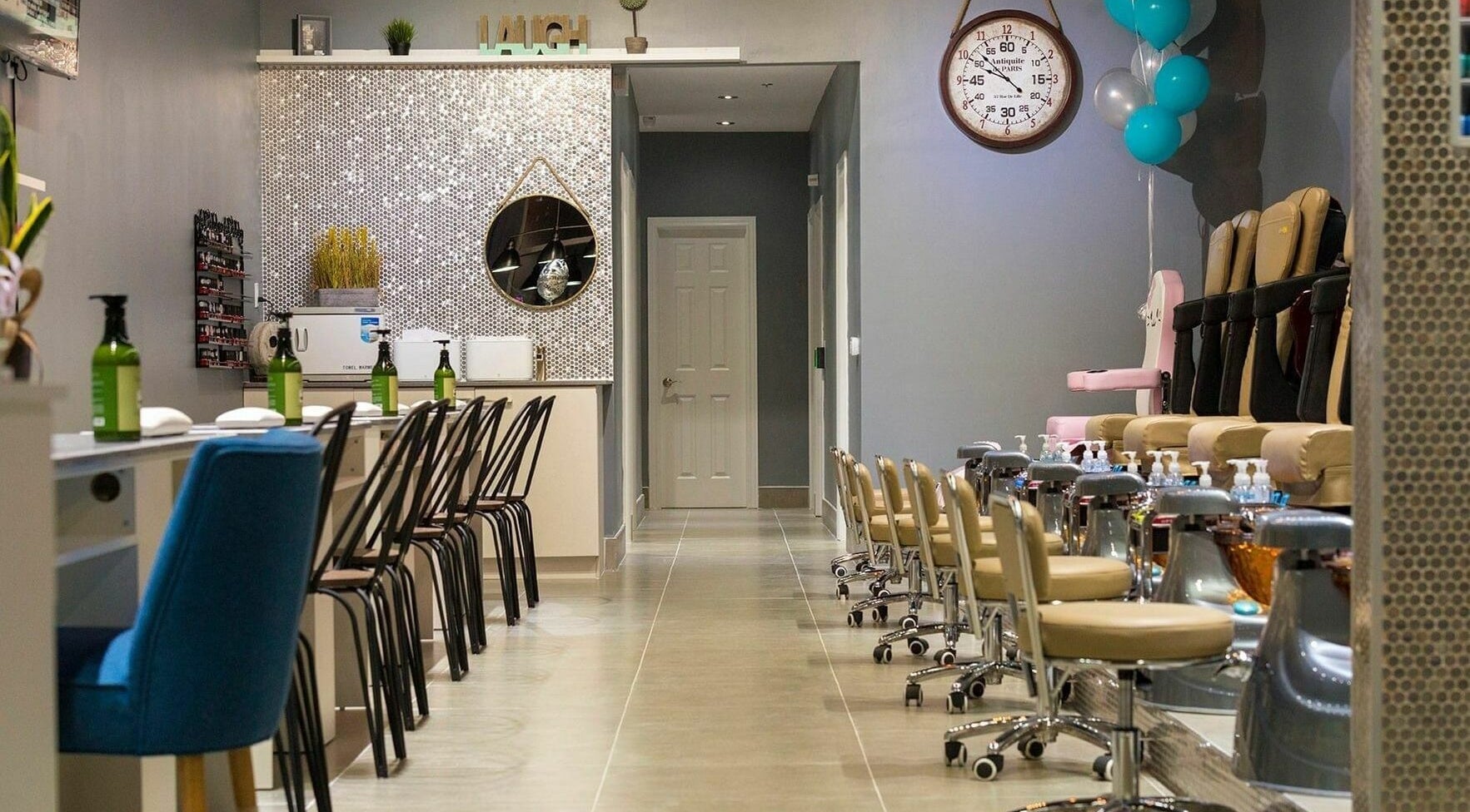 Sophisticated nail salon interior at Glowin’ Nails & Spa, Aurora, Ontario, CA with stylish pedicure stations.