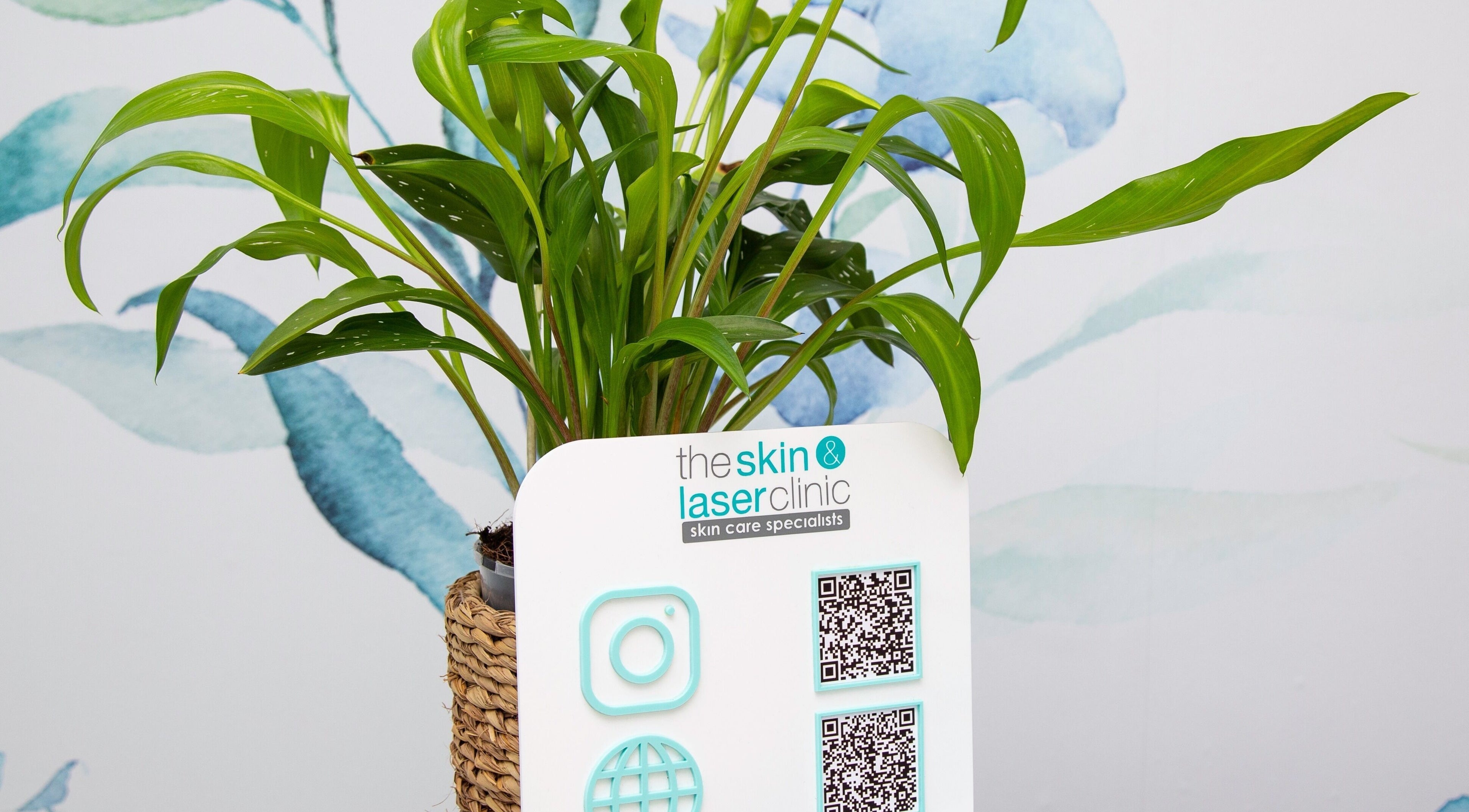 Vibrant plant and signage at The Skin and Laser Clinic, Durban North, Kwazulu-natal, ZA, enhance natural serenity.