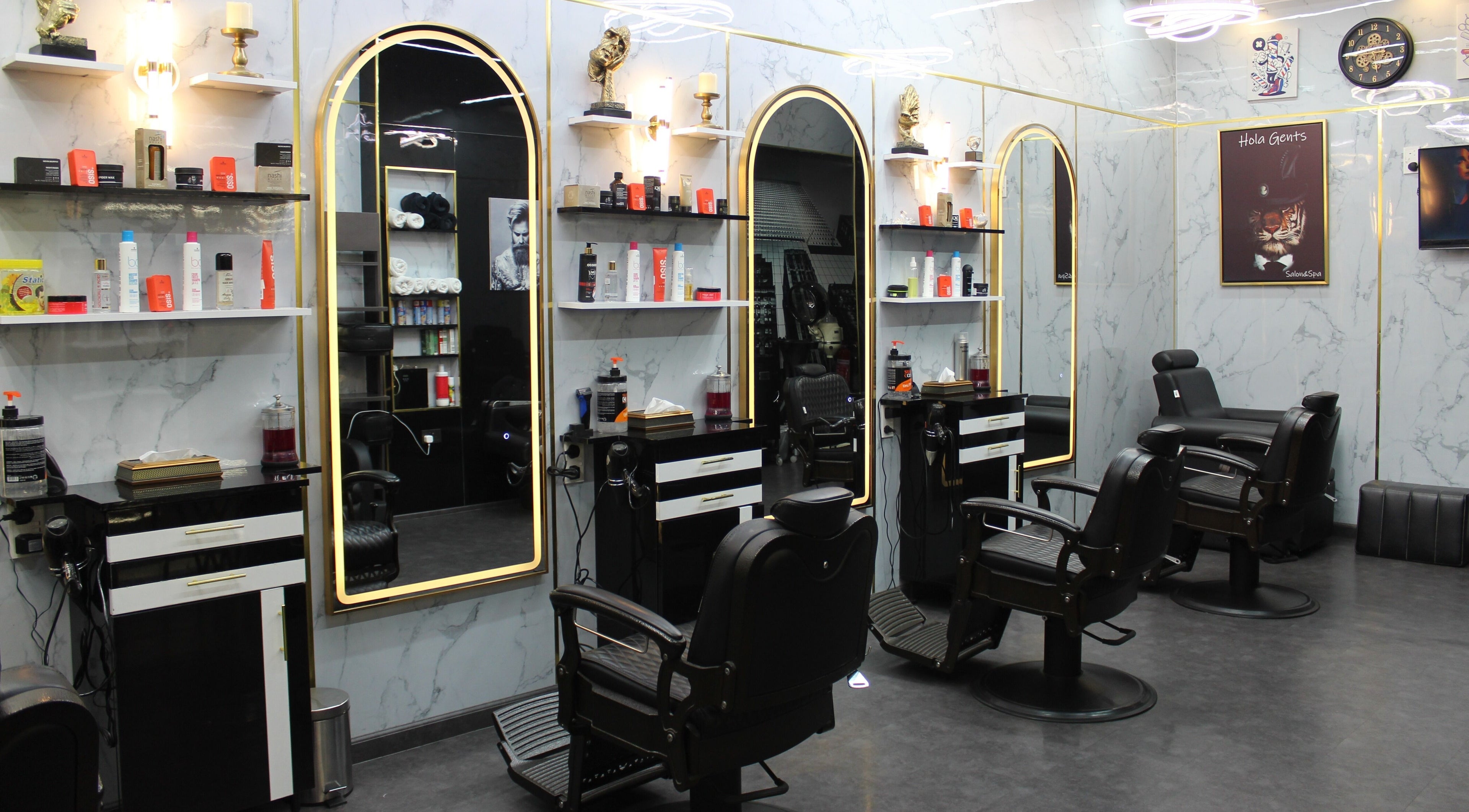 Elegant interior of Hola Gents Salon in Dubai, AE showcasing modern barber chairs and mirrors.