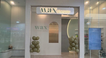 Entrance of Wax Therapy Hyperdome at Loganholme, Queensland, AU featuring modern decor and balloons.