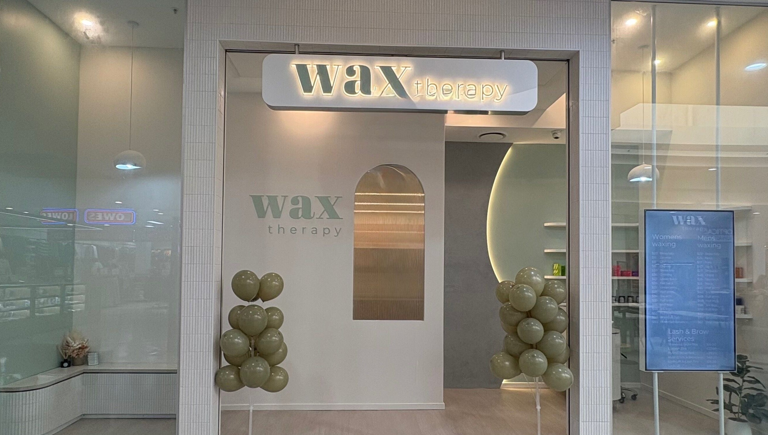 Front view of Wax Therapy Hyperdome in Loganholme, Queensland, AU with elegant balloon decor.