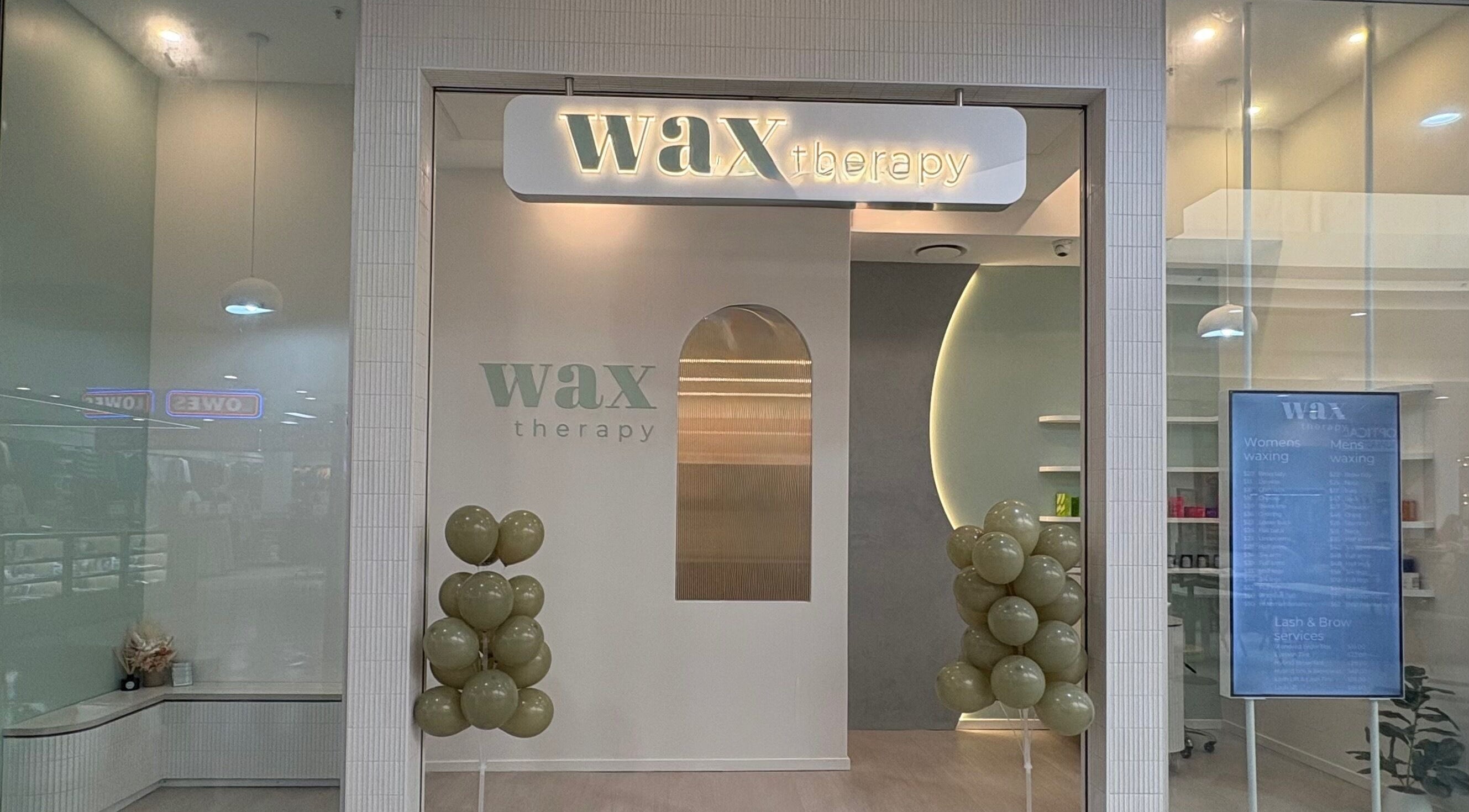 Front view of Wax Therapy Hyperdome in Loganholme, Queensland, AU with elegant balloon decor.
