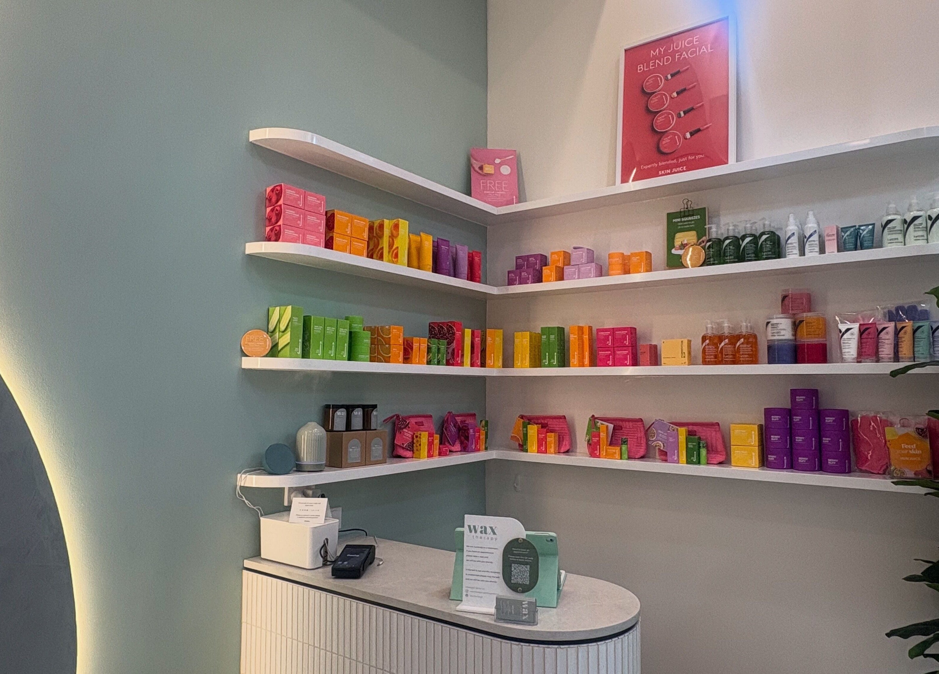Product shelves at Wax Therapy Hyperdome, Loganholme, Queensland, AU showcasing vibrant beauty products.