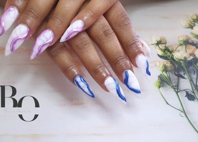 Stylish nail art with purple and blue accents at Black Orchid Beauty Bar, Johannesburg, Gauteng, ZA.