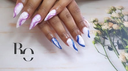 Stylish nail art with purple and blue accents at Black Orchid Beauty Bar, Johannesburg, Gauteng, ZA.